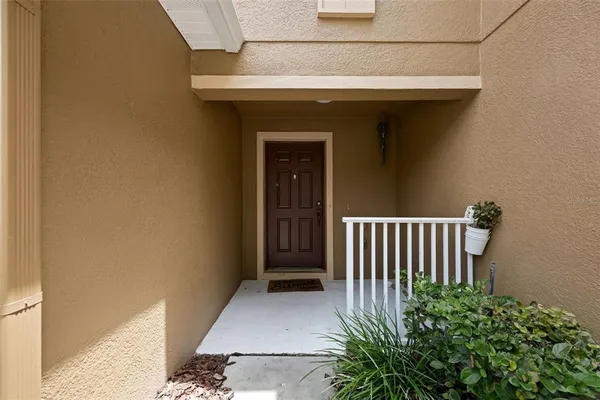 a view of a door and wooden floor