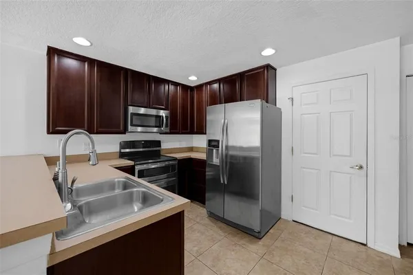 a kitchen with a sink and a window