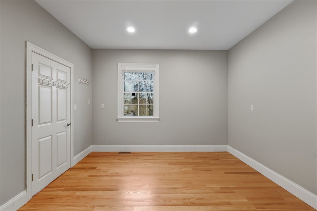 1327 Liberty Street, Unit 2 Braintree, MA 02184 - Photo 14 of 20 wooden floor in an empty room with a window