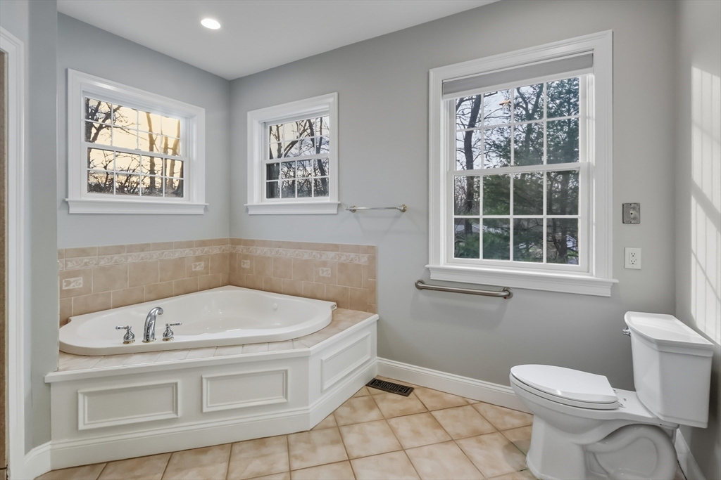 1327 Liberty Street, Unit 2 Braintree, MA 02184 - Photo 18 of 20 a bathroom with a bathtub and window