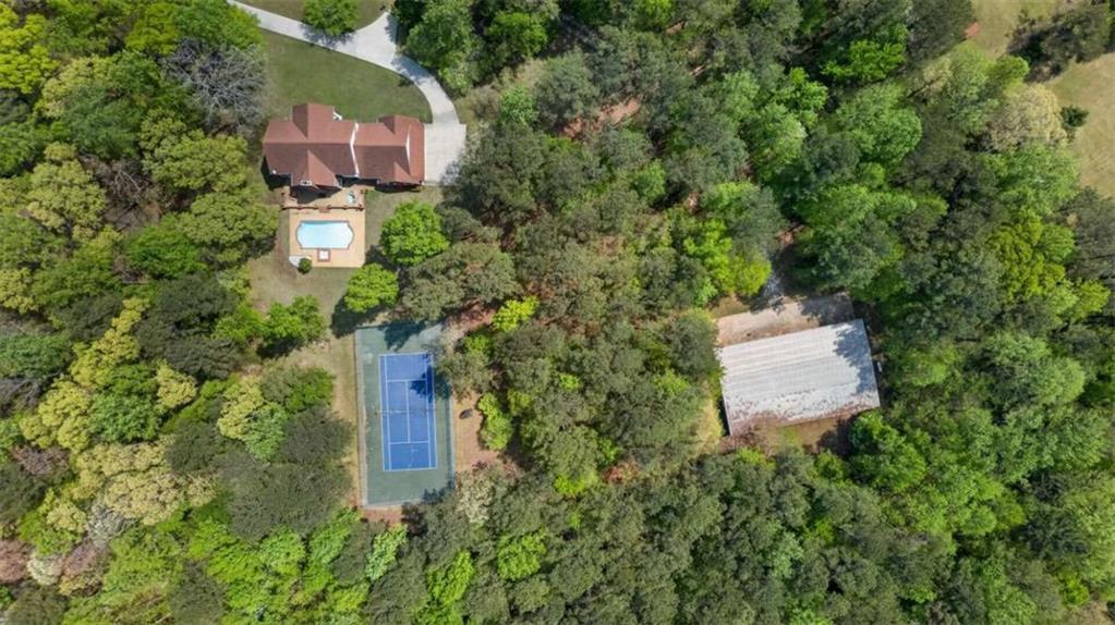 3035 Mt Zion Road Oxford, GA 30054 - Photo 96 of 99 an aerial view of a house with a yard and lake view