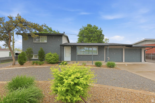 299 Birch Street Tooele, UT 84074 - Photo 1 of 1 Tri-level home with driveway, an attached garage, and brick siding
