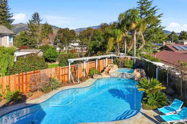 a view of a swimming pool with a patio