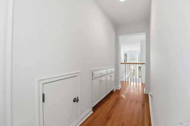 a bedroom with a bed and a mirror