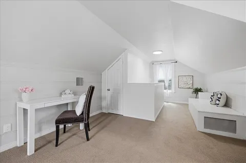 a workspace with furniture and window