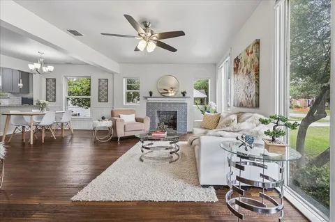 a living room with furniture fireplace and window