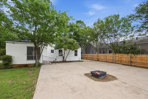 a view of backyard with trampoline