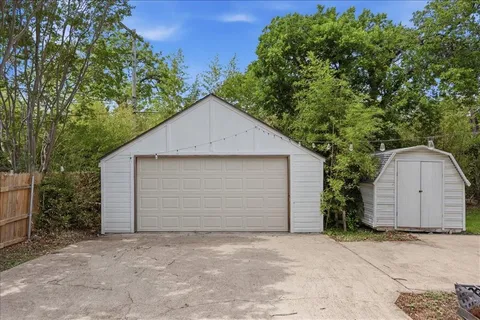 a view of garage and yard