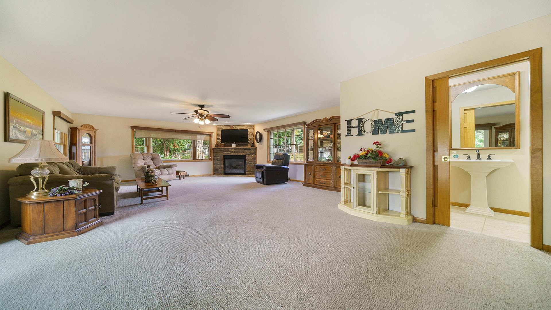 310 Barbara Street Mount Morris, IL 61054 - Photo 12 of 36 a living room with furniture and a flat screen tv