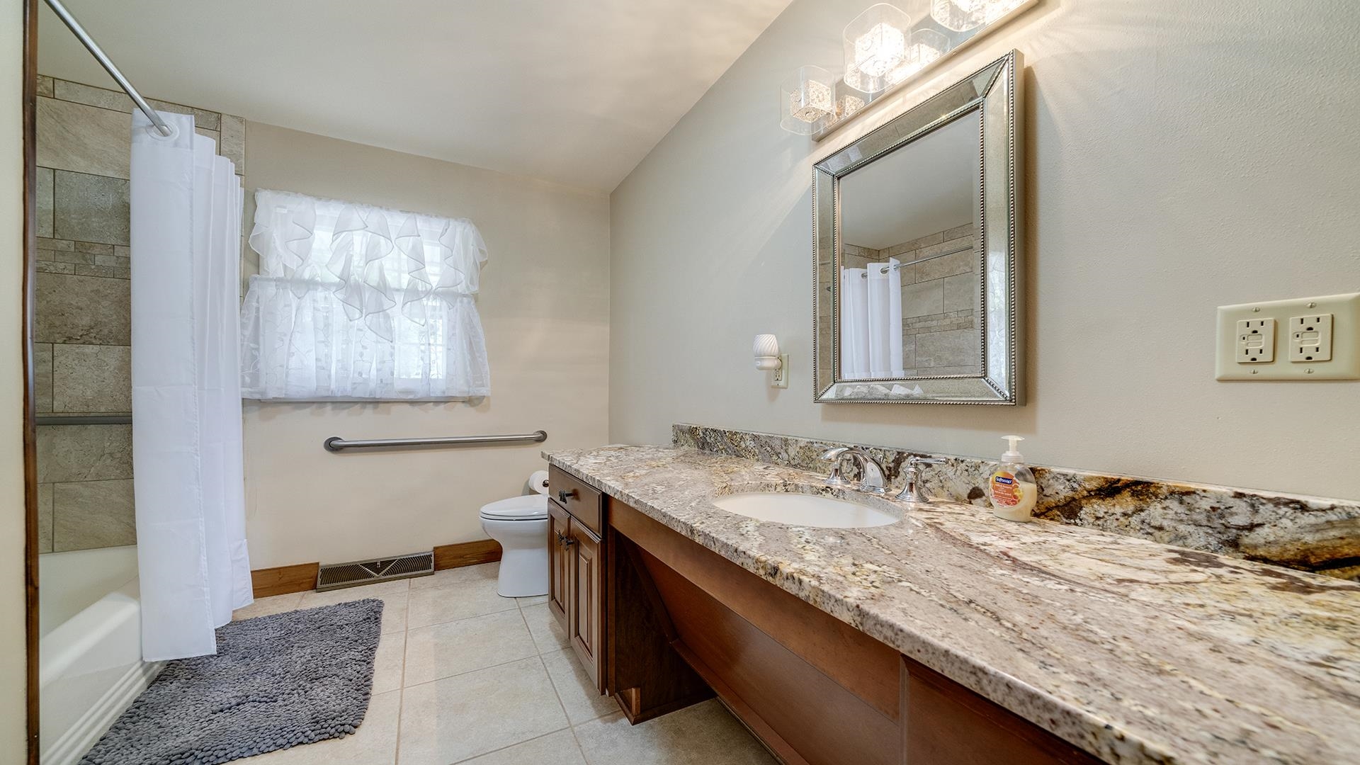310 Barbara Street Mount Morris, IL 61054 - Photo 20 of 36 a bathroom with a granite countertop sink and a mirror