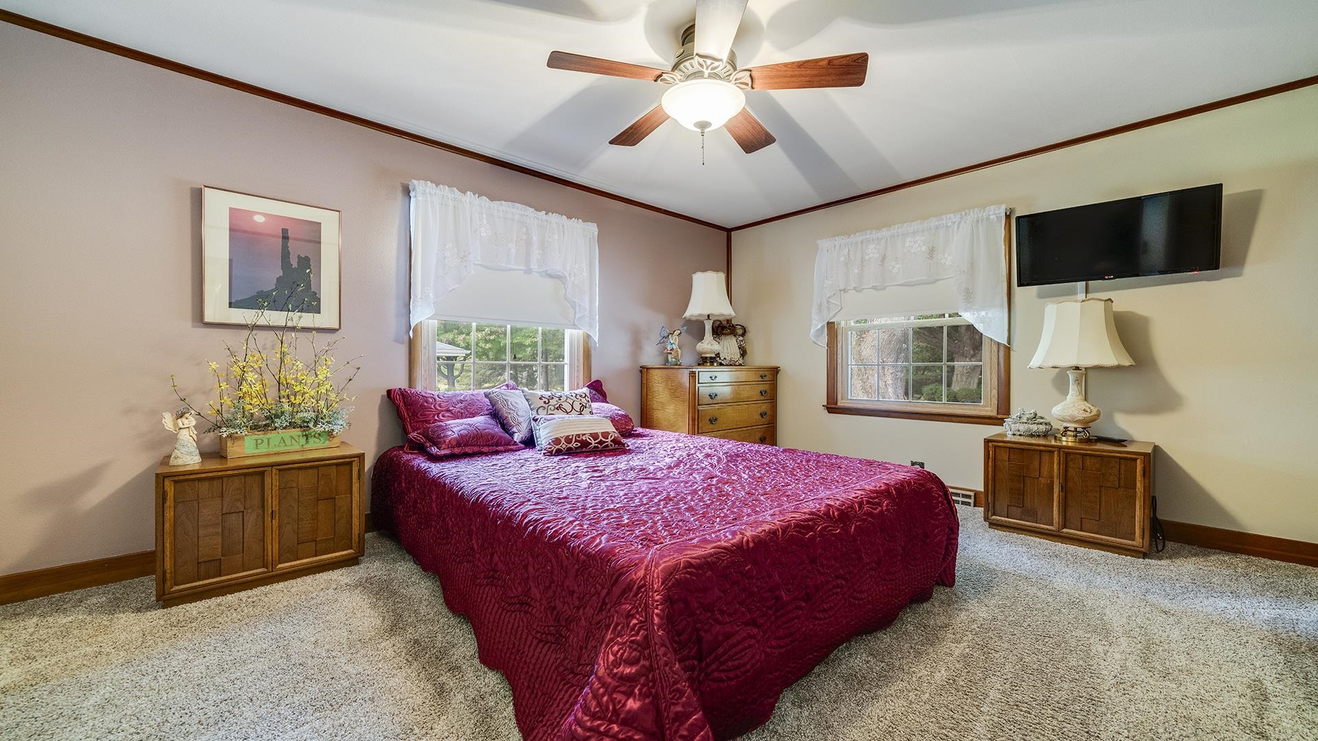 310 Barbara Street Mount Morris, IL 61054 - Photo 23 of 36 a bed room with a bed window and a flat screen tv