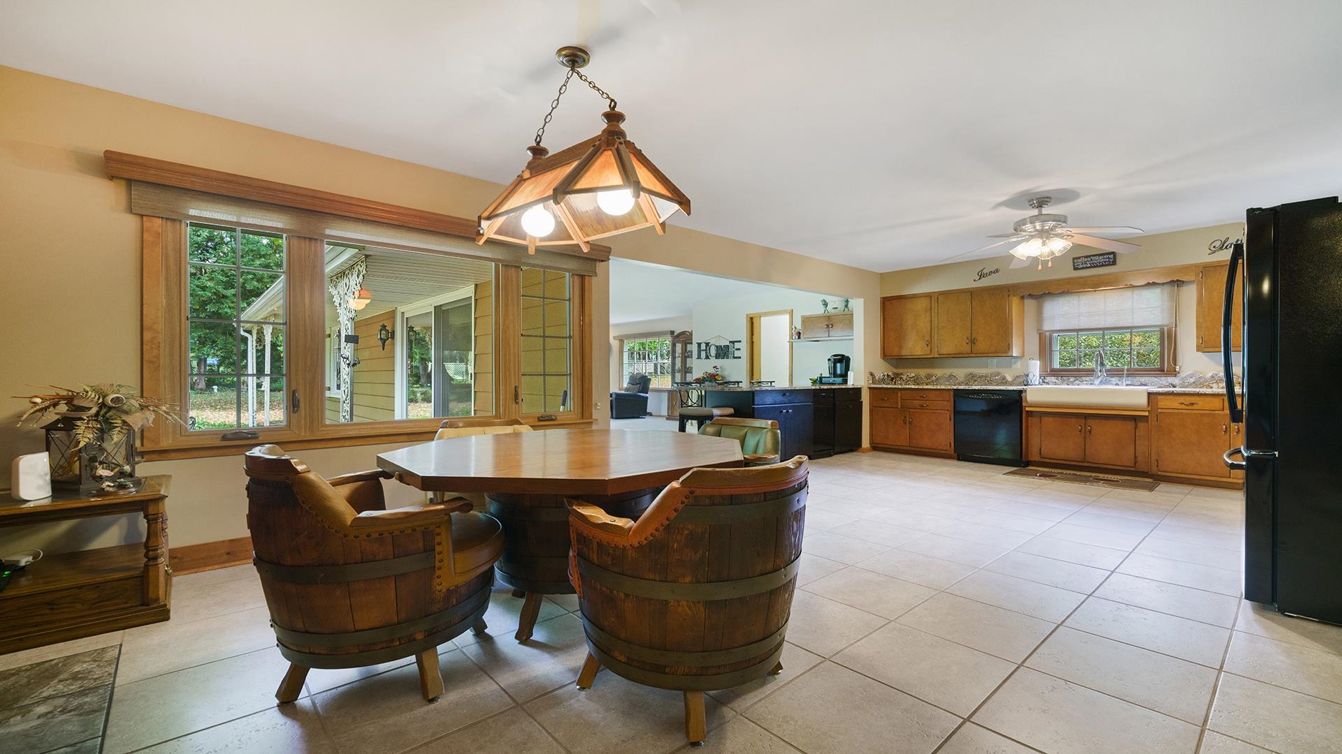 310 Barbara Street Mount Morris, IL 61054 - Photo 6 of 36 a living room with furniture a flat screen tv and floor to ceiling windows