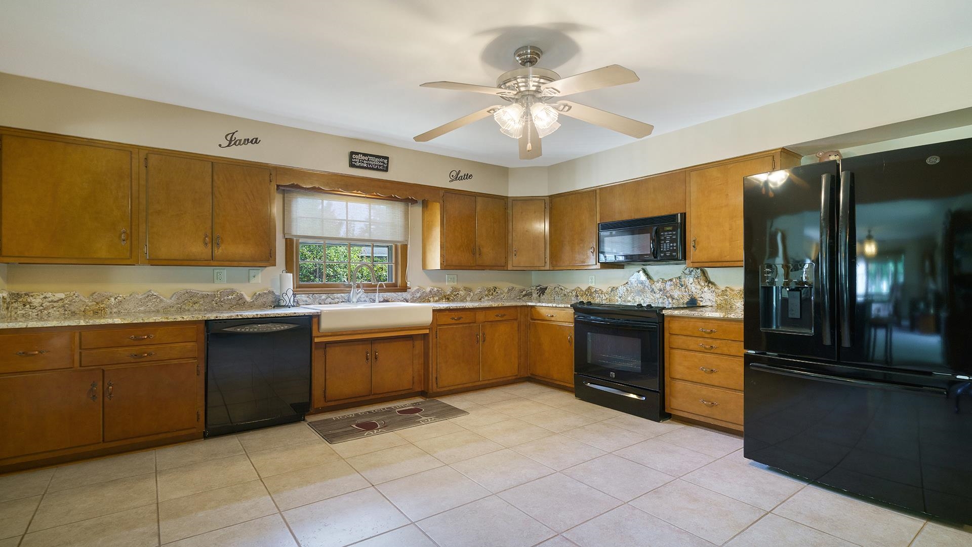 310 Barbara Street Mount Morris, IL 61054 - Photo 8 of 36 a kitchen with a sink cabinets and window
