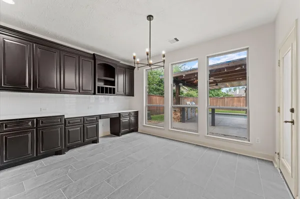 a kitchen with stainless steel appliances granite countertop a stove and cabinets