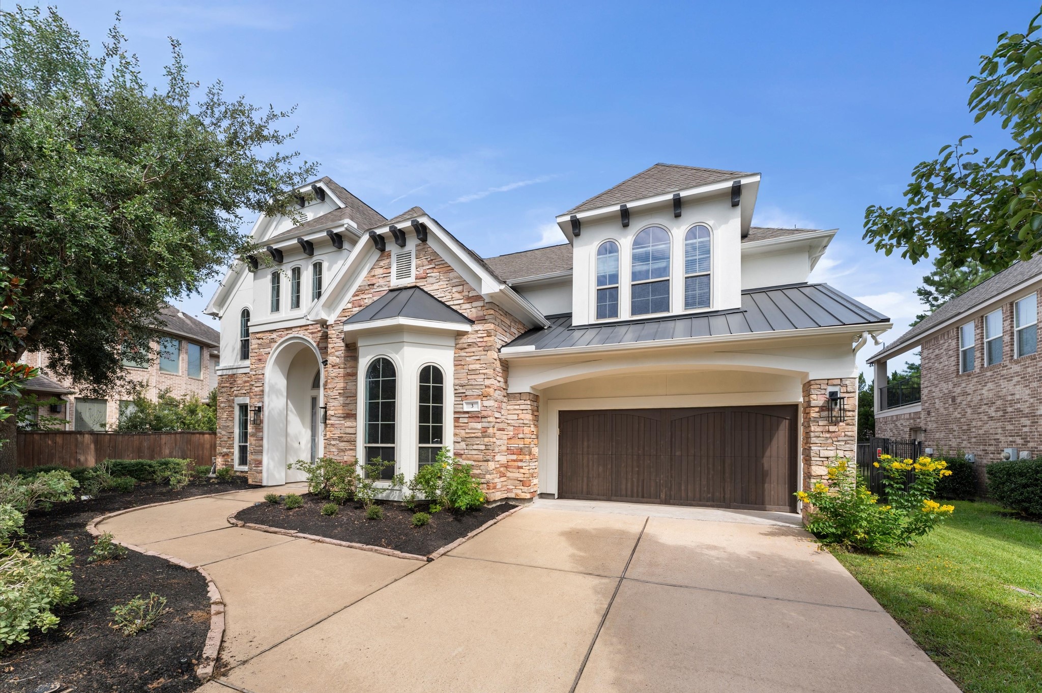 3 North Beech Springs Circle Spring, TX 77389 - Photo 2 of 43 a front view of a house with yard and parking