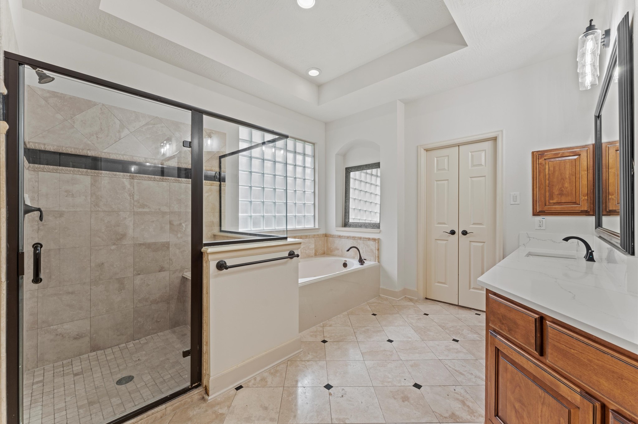 3 North Beech Springs Circle Spring, TX 77389 - Photo 21 of 43 a spacious bathroom with a shower sink and mirror