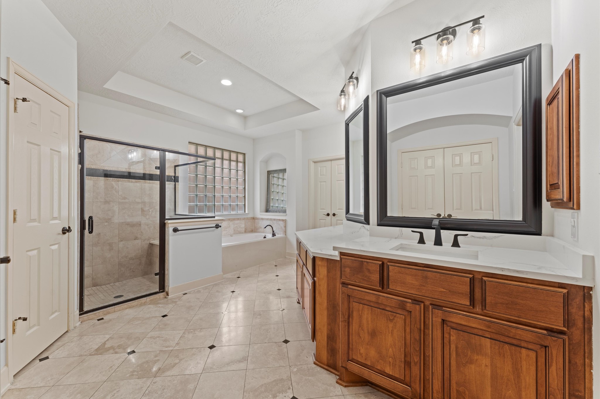 3 North Beech Springs Circle Spring, TX 77389 - Photo 22 of 43 a bathroom with a double vanity sink mirror and