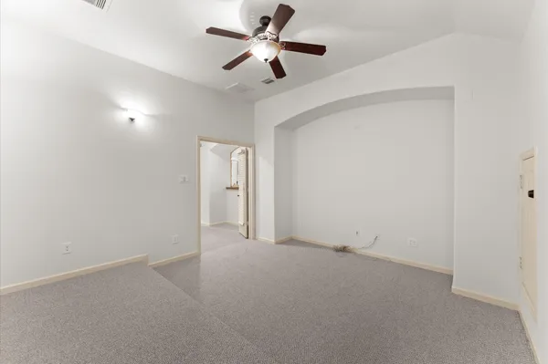 a view of room with ceiling fan