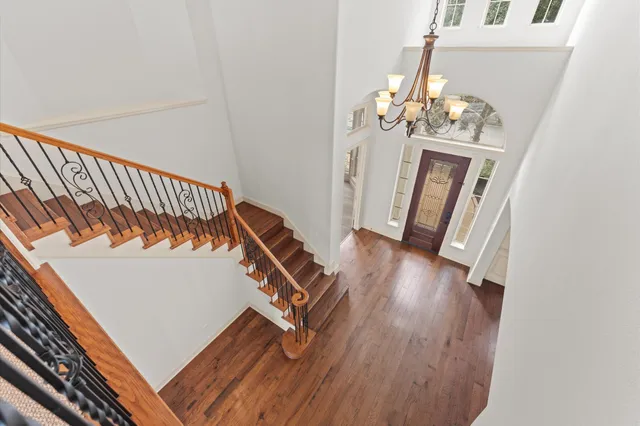 a view of an entryway with wooden floor