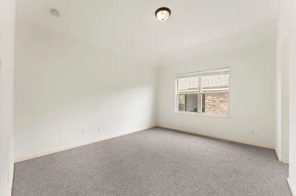 an empty room with a empty space and window