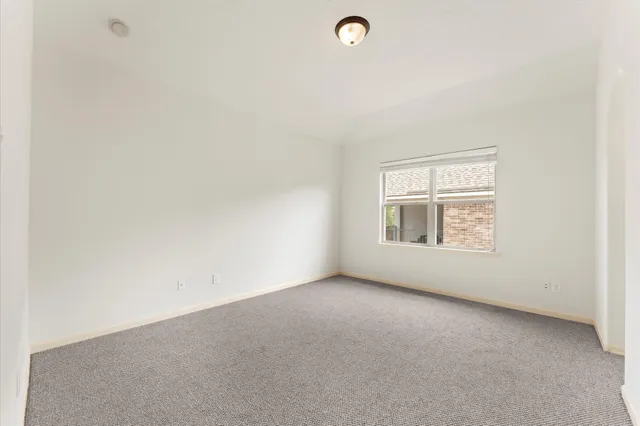an empty room with a empty space and window