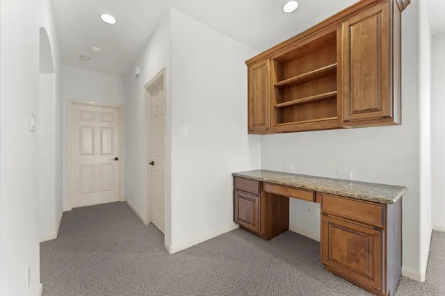 a view of cabinets and wooden floor