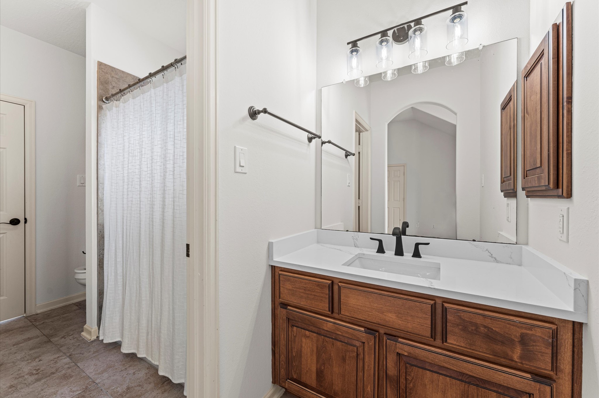 3 North Beech Springs Circle Spring, TX 77389 - Photo 33 of 43 a bathroom with a double vanity sink and a mirror