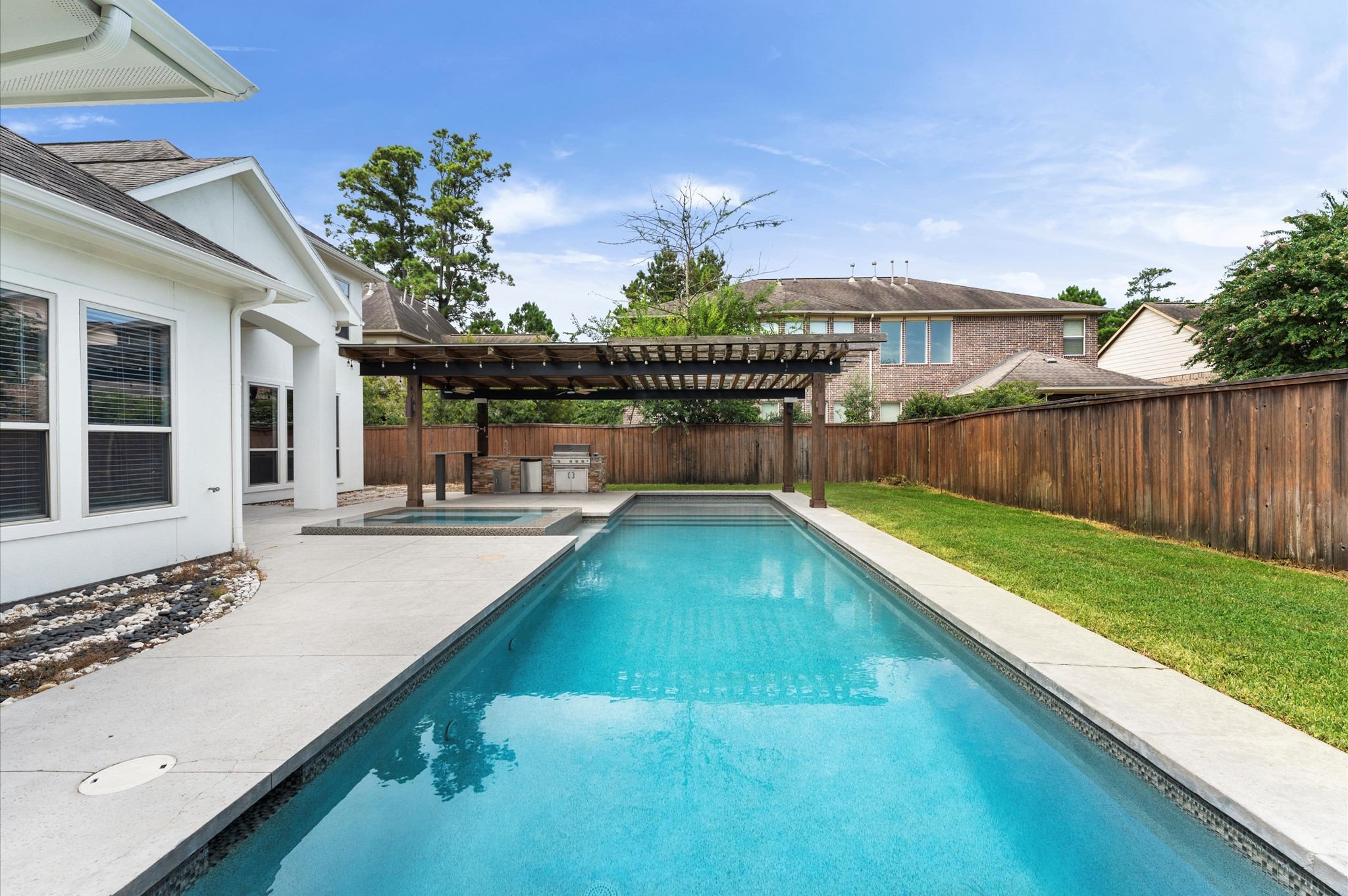 3 North Beech Springs Circle Spring, TX 77389 - Photo 41 of 43 a view of a swimming pool with a patio