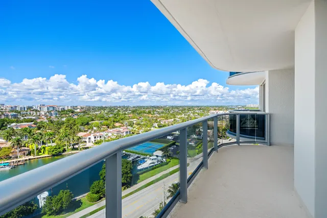 a view of a two chairs in the balcony