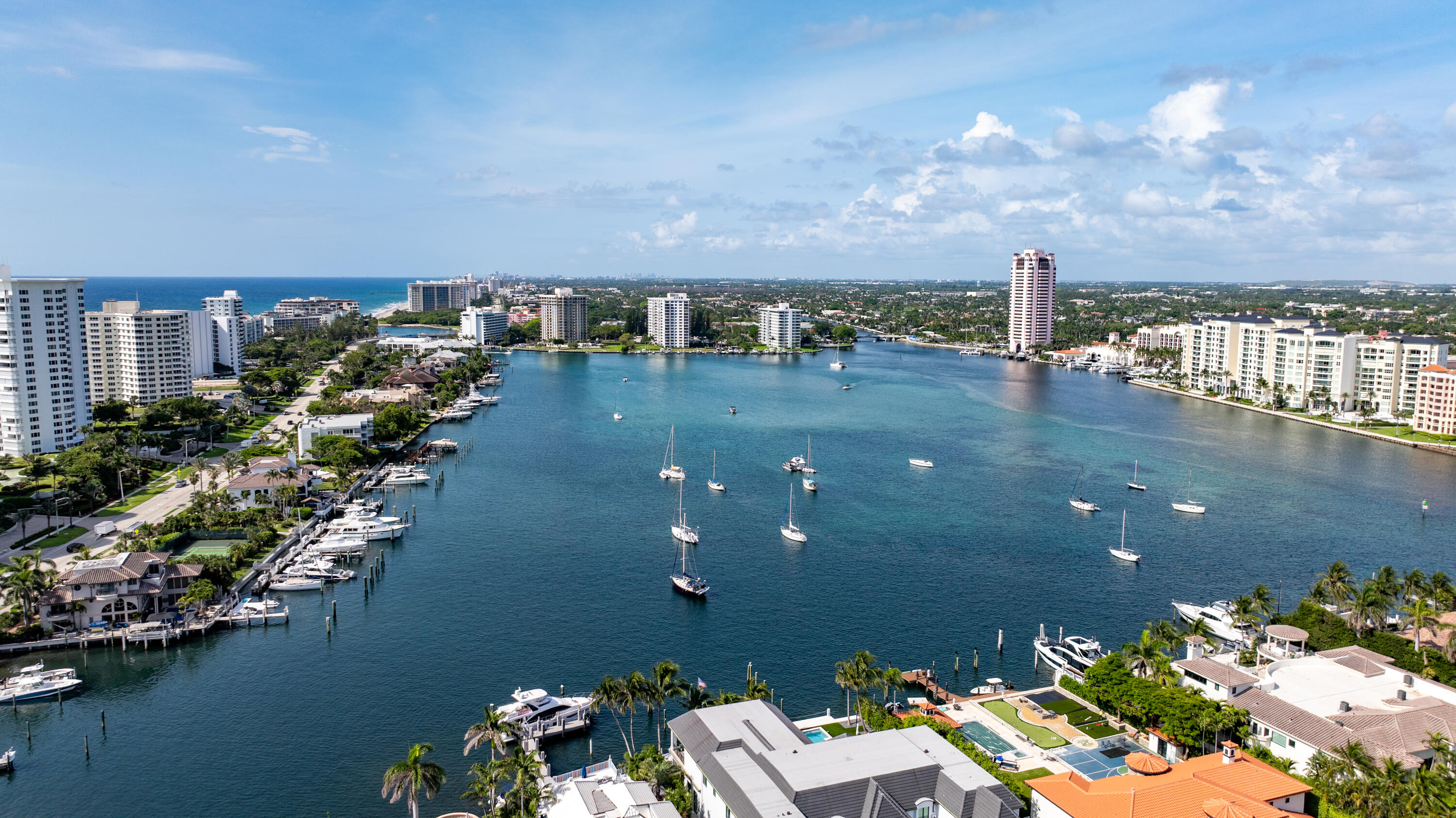 350 South Ocean Boulevard, Unit 12C Boca Raton, FL 33432 - Photo 42 of 50 a view of a lake with lawn chairs