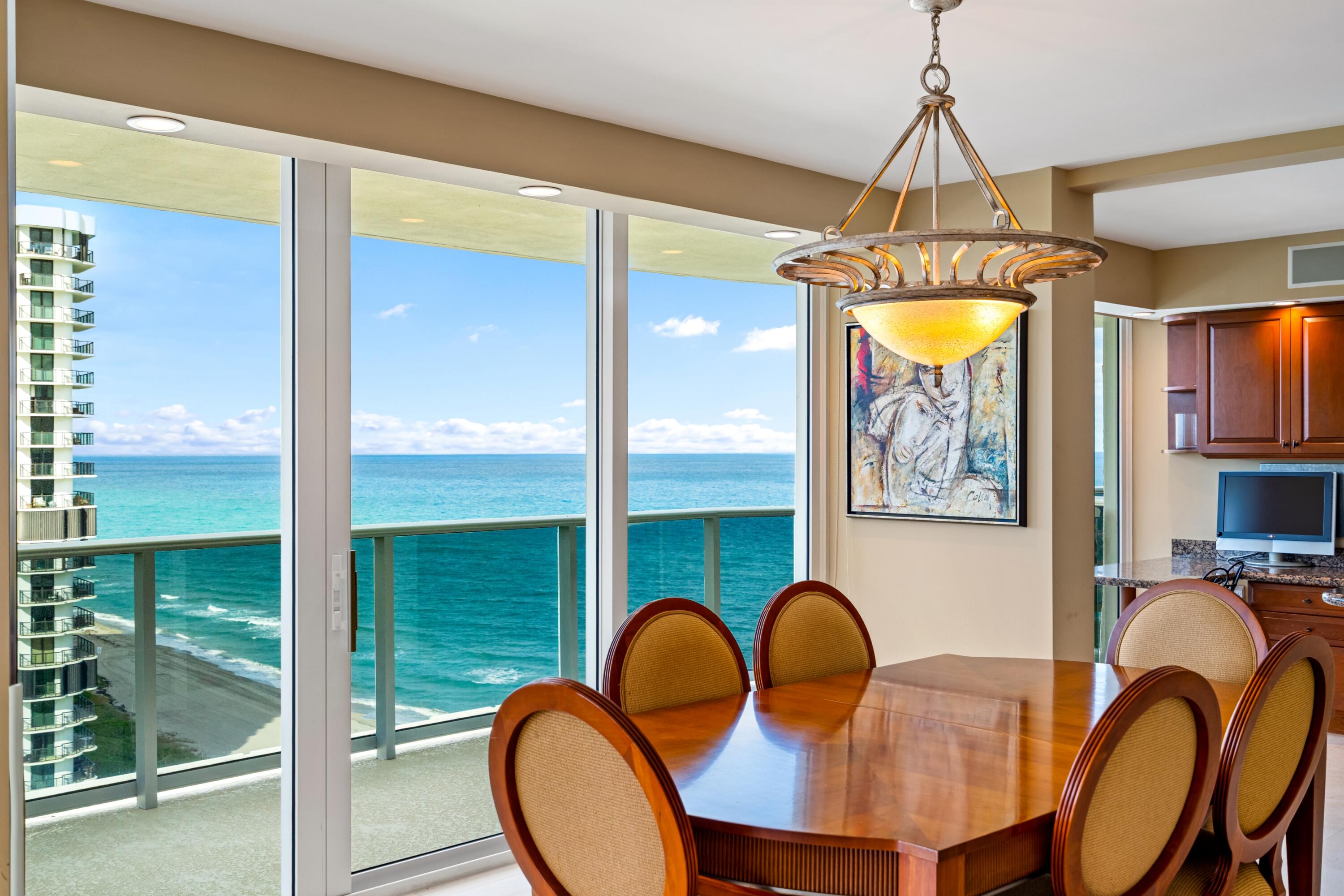 350 South Ocean Boulevard, Unit 12C Boca Raton, FL 33432 - Photo 10 of 50 a dining room with furniture and window