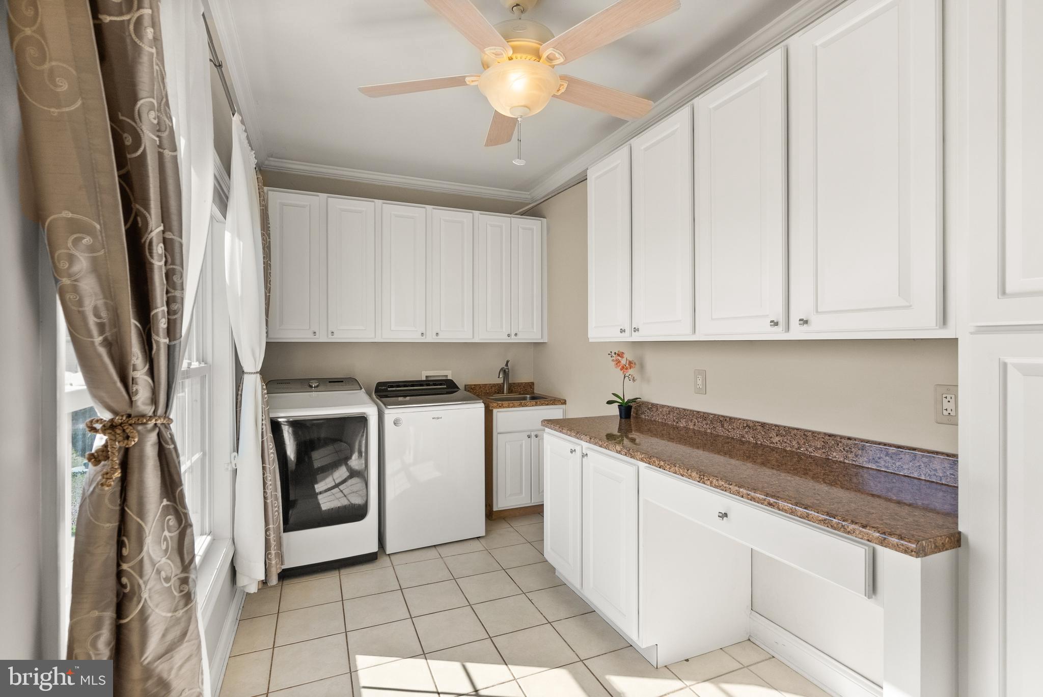 13145 Carriage Ford Road Nokesville, VA 20181 - Photo 15 of 70 a kitchen with stainless steel appliances granite countertop a stove a sink and a refrigerator