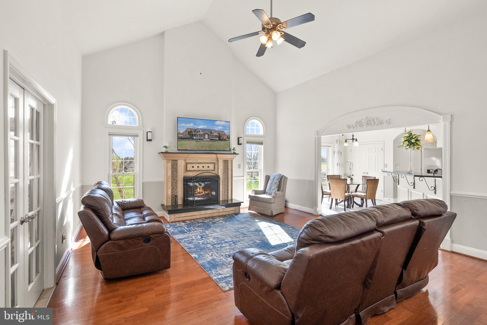 13145 Carriage Ford Road Nokesville, VA 20181 - Photo 17 of 70 a living room with furniture a large window and a fireplace