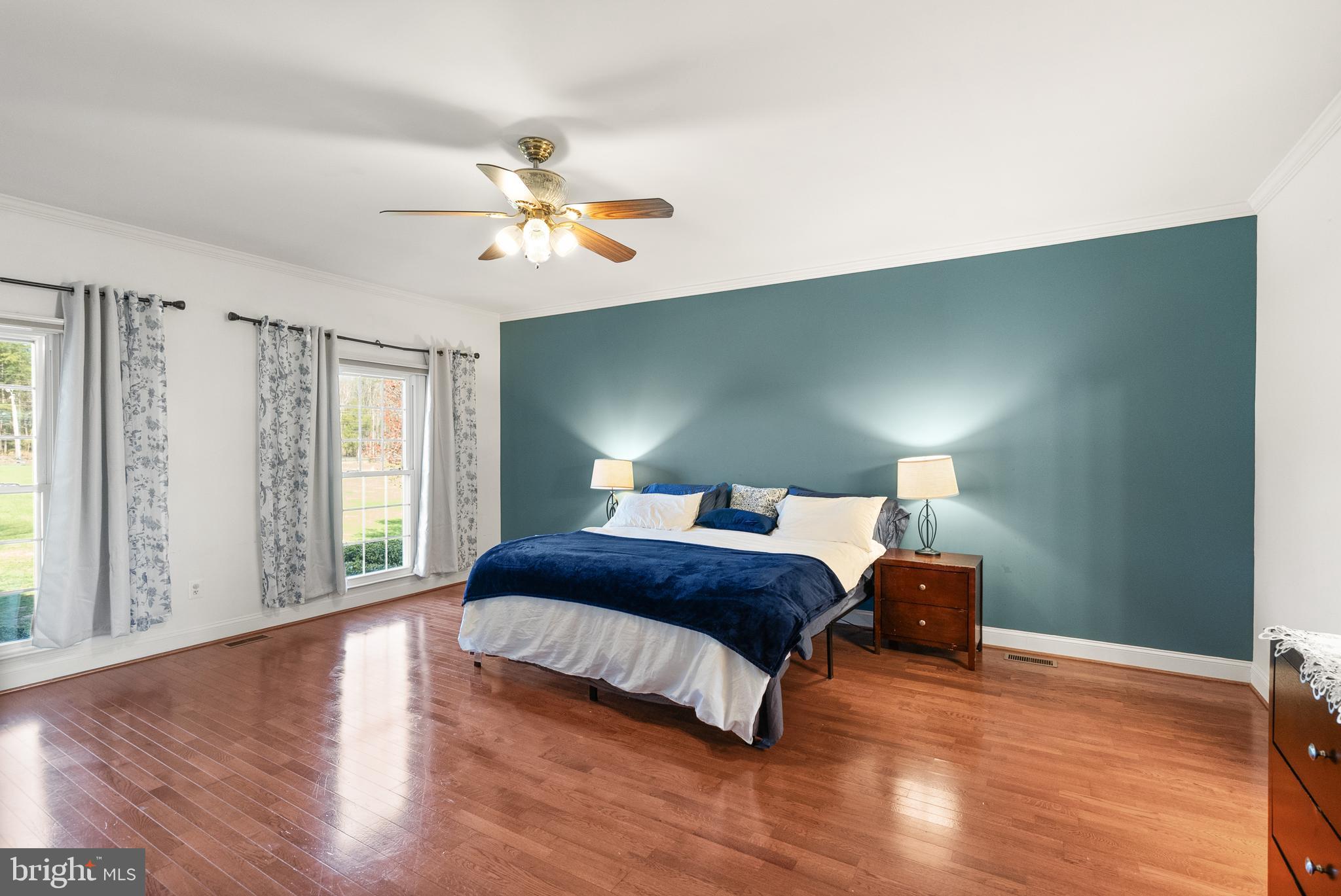 13145 Carriage Ford Road Nokesville, VA 20181 - Photo 20 of 70 a bedroom with a bed and wooden floor