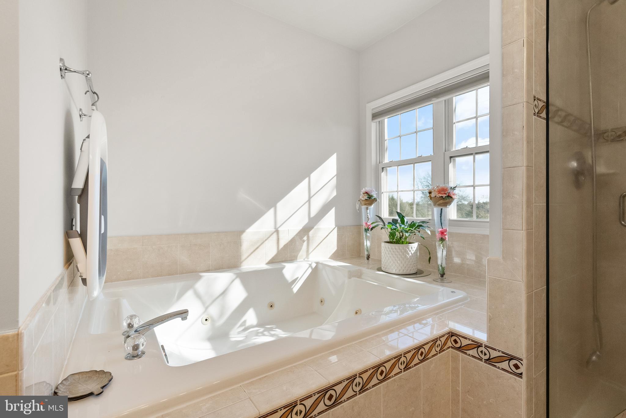 13145 Carriage Ford Road Nokesville, VA 20181 - Photo 23 of 70 a bathroom with a sink and a mirror