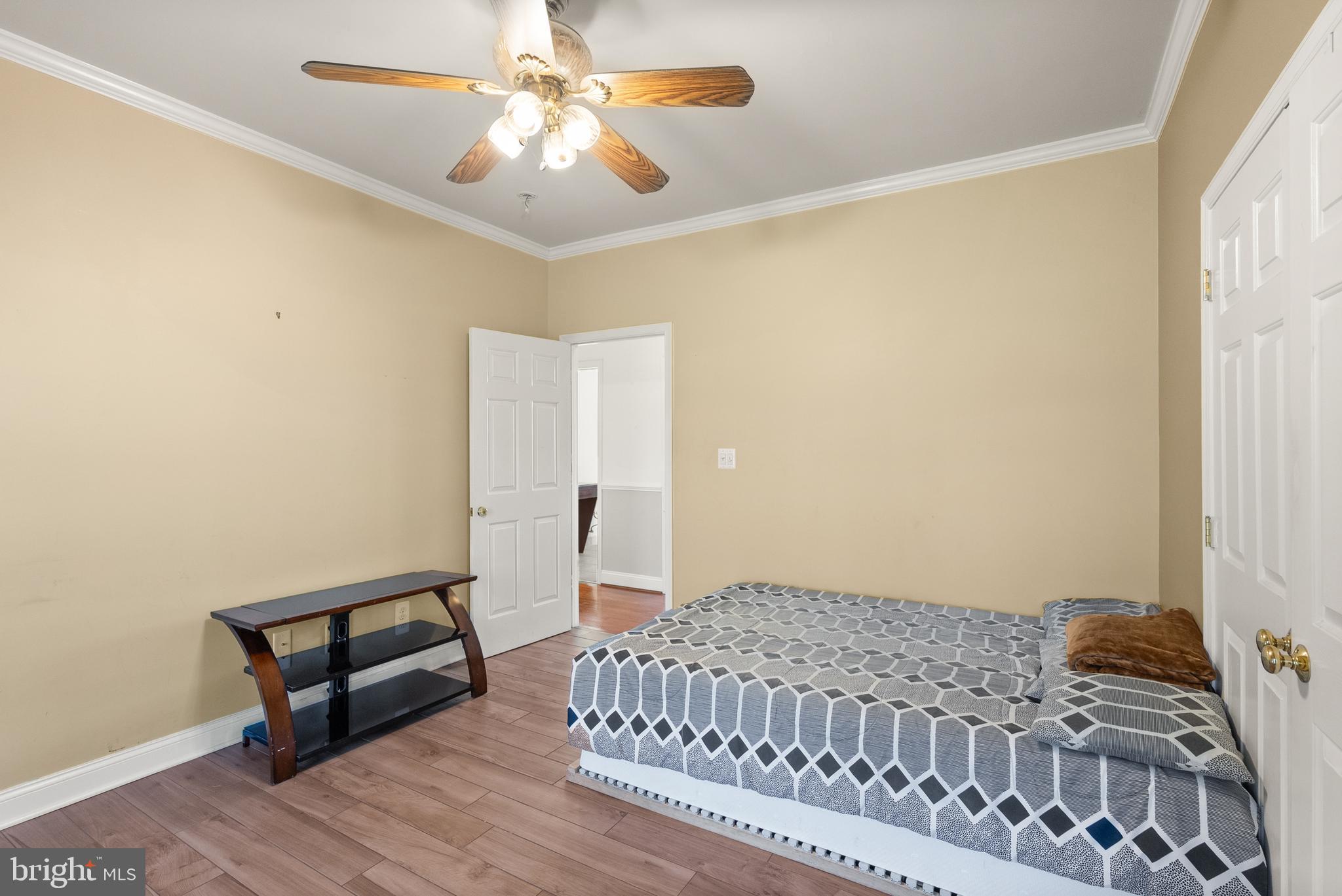 13145 Carriage Ford Road Nokesville, VA 20181 - Photo 29 of 70 a bedroom with a bed and a chandelier
