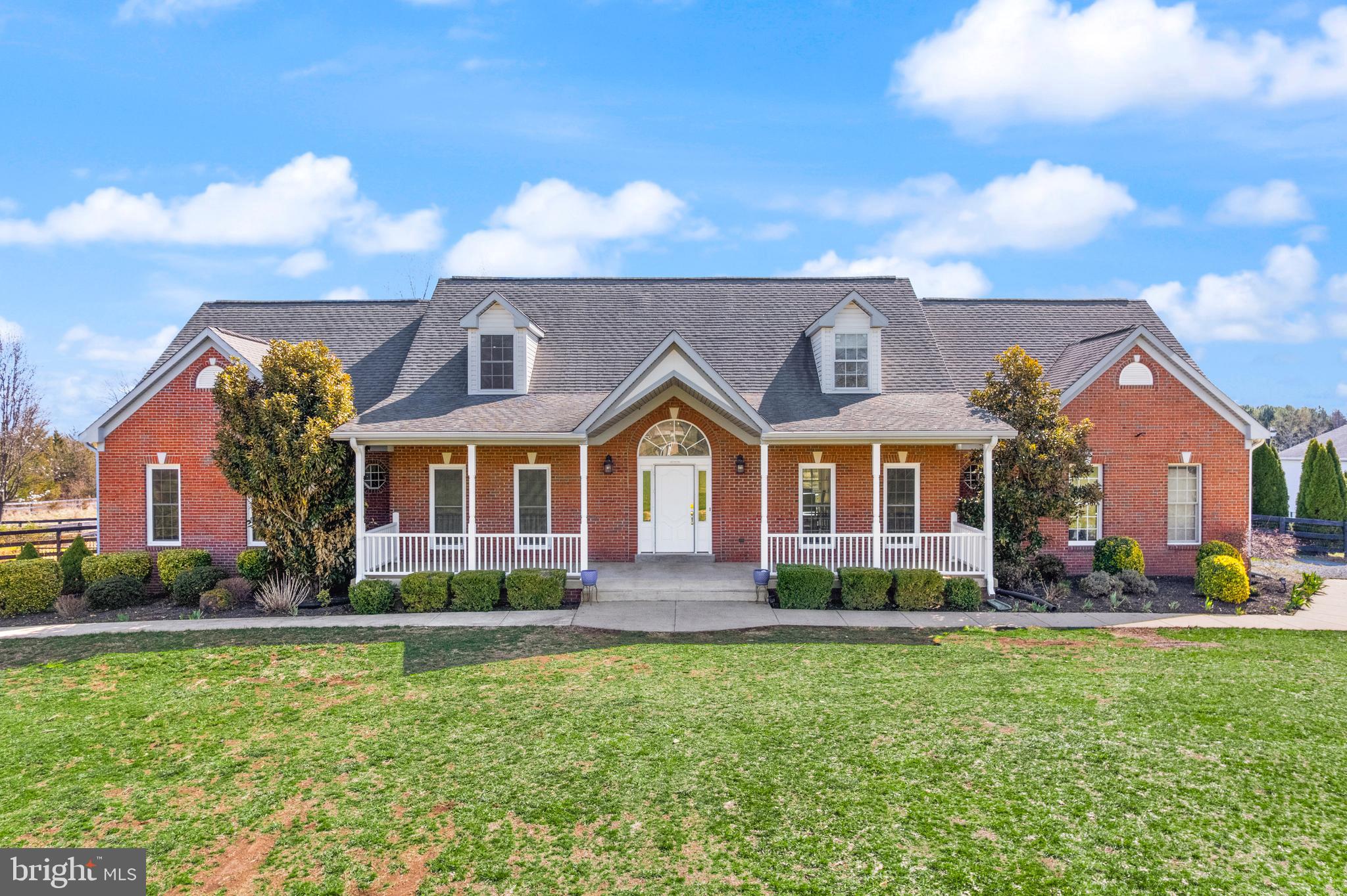 13145 Carriage Ford Road Nokesville, VA 20181 - Photo 3 of 70 a front view of a house with garden