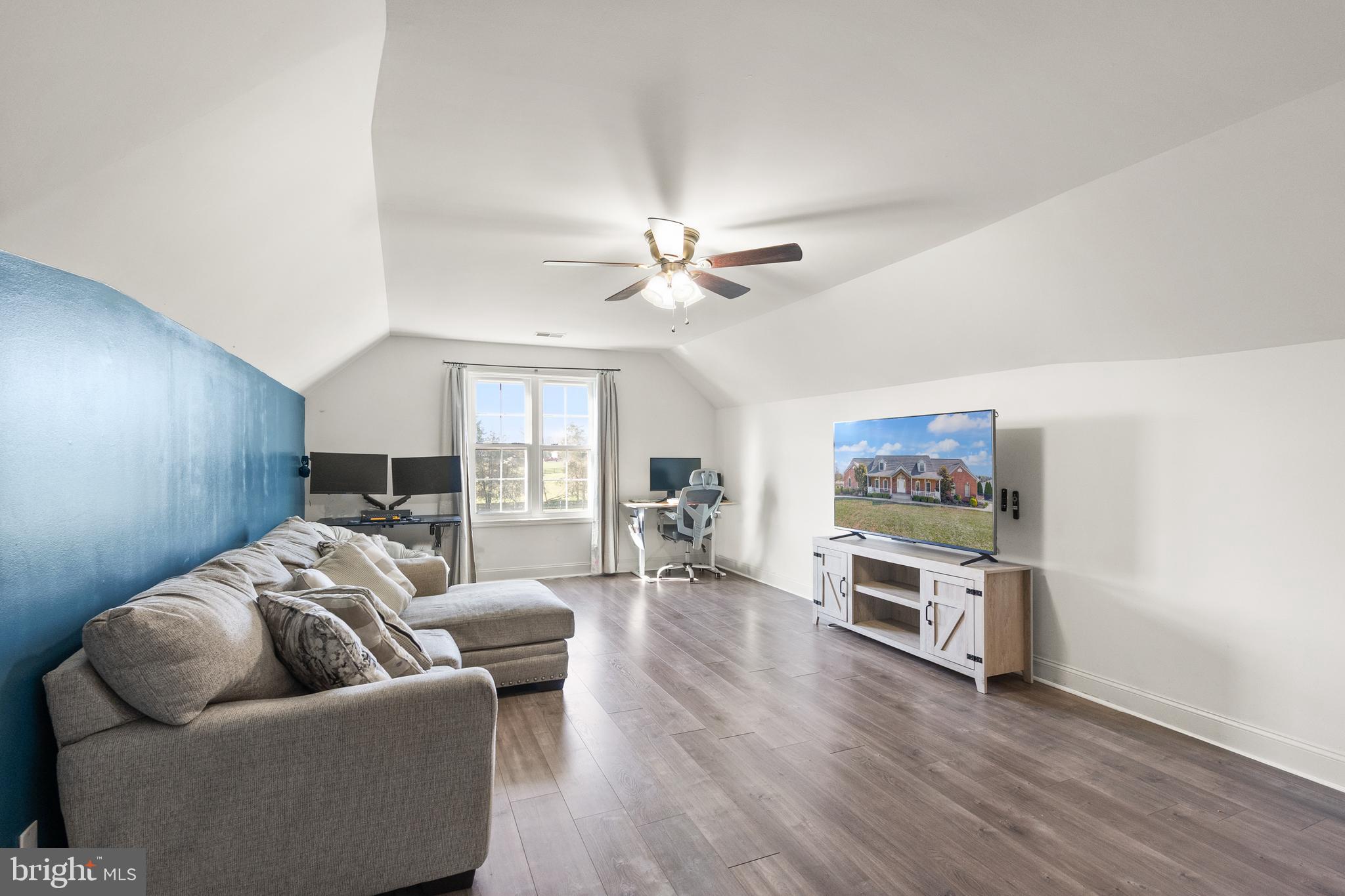 13145 Carriage Ford Road Nokesville, VA 20181 - Photo 36 of 70 a living room with furniture and a ceiling fan