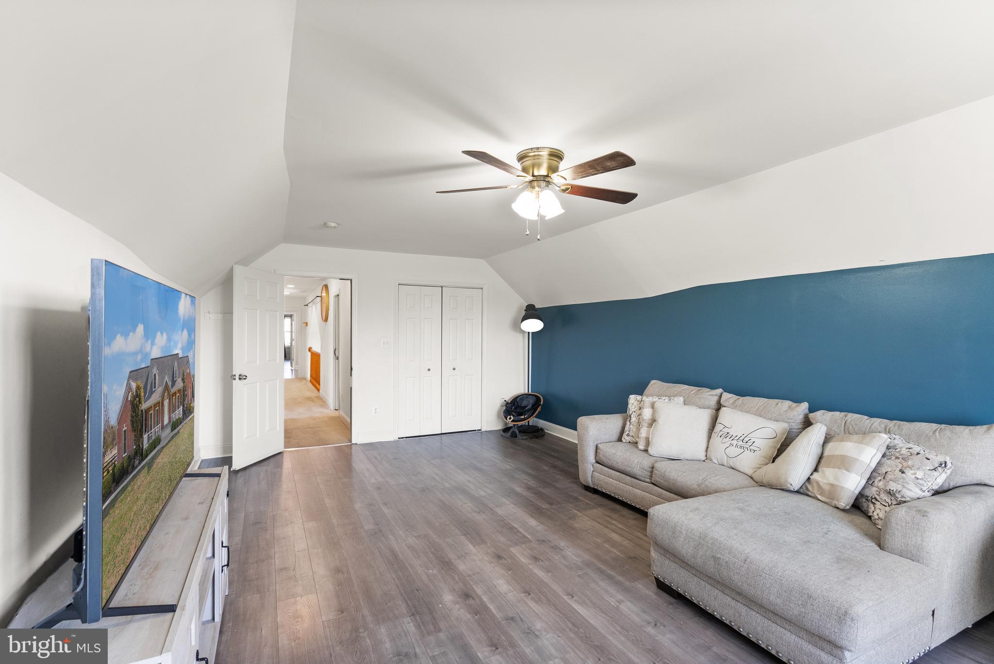 13145 Carriage Ford Road Nokesville, VA 20181 - Photo 37 of 70 a living room with furniture and a flat screen tv
