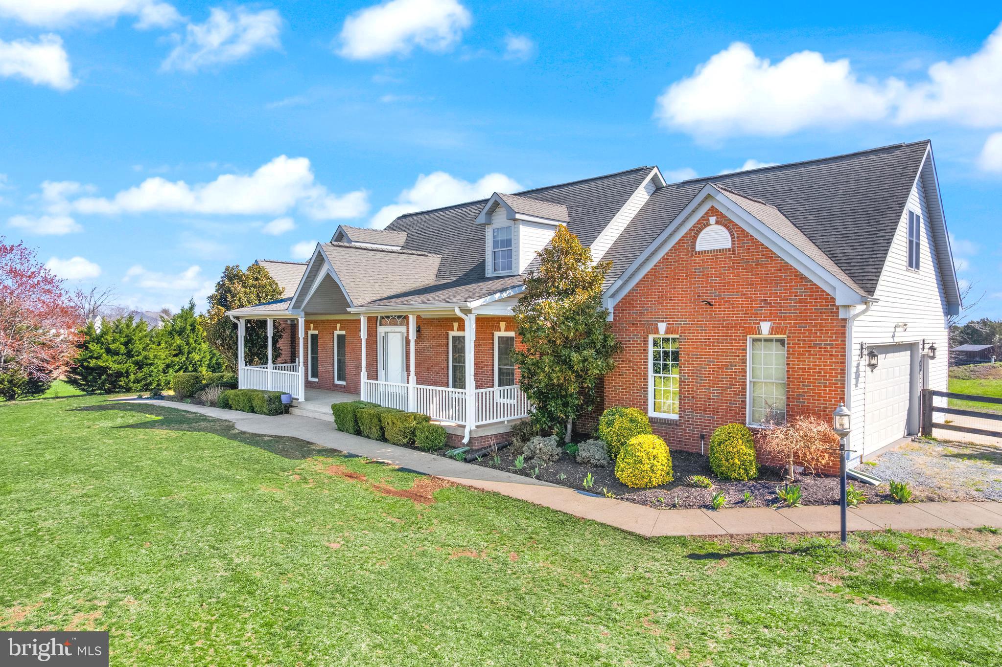 13145 Carriage Ford Road Nokesville, VA 20181 - Photo 4 of 70 a front view of a house with a yard