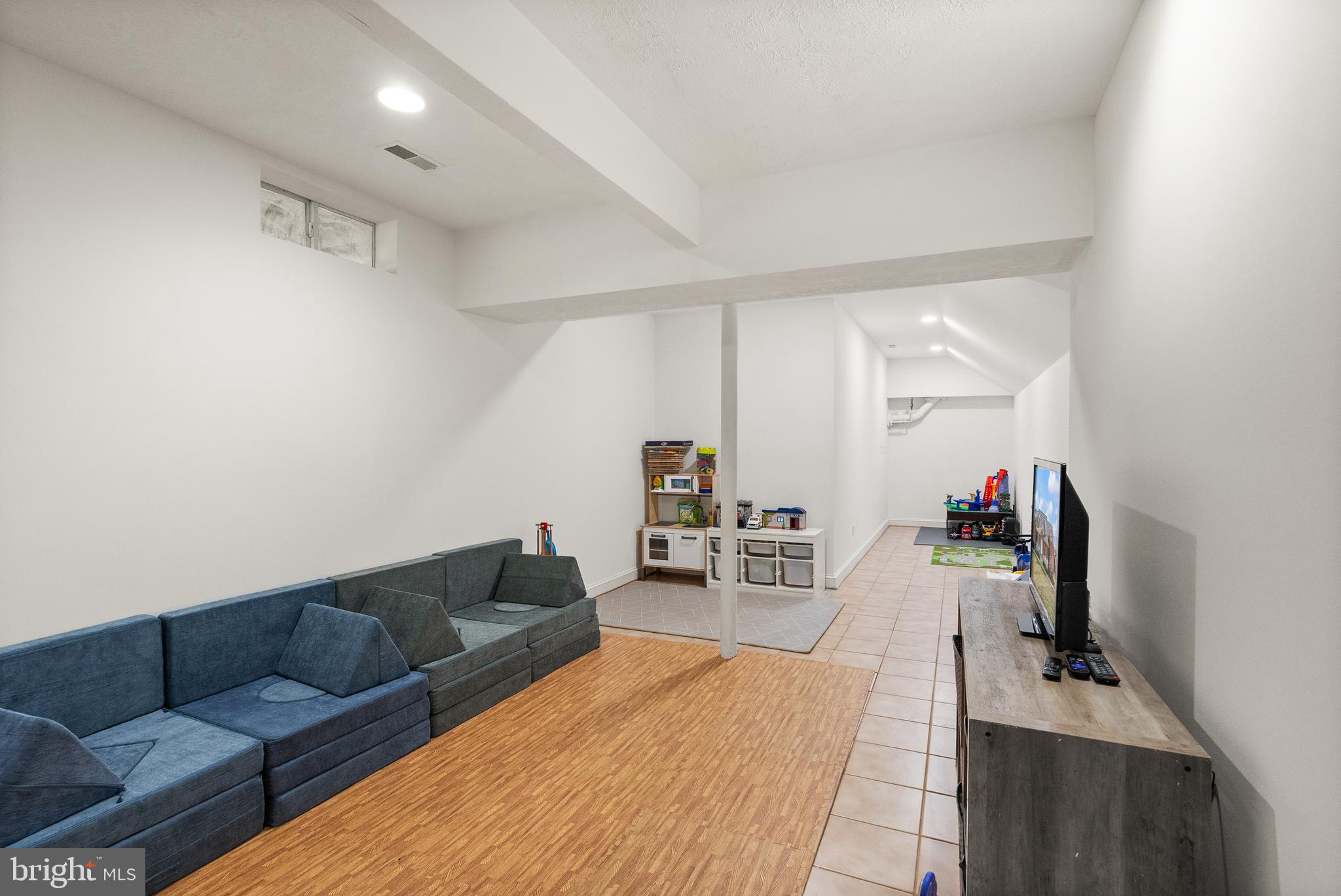 13145 Carriage Ford Road Nokesville, VA 20181 - Photo 50 of 70 a living room with furniture and a wooden floor