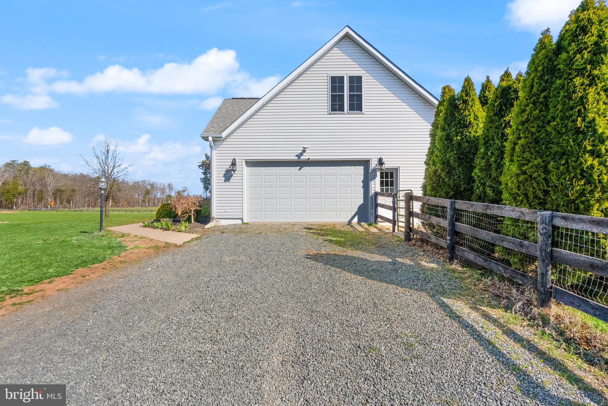13145 Carriage Ford Road Nokesville, VA 20181 - Photo 5 of 70 a view of a house with backyard and trees