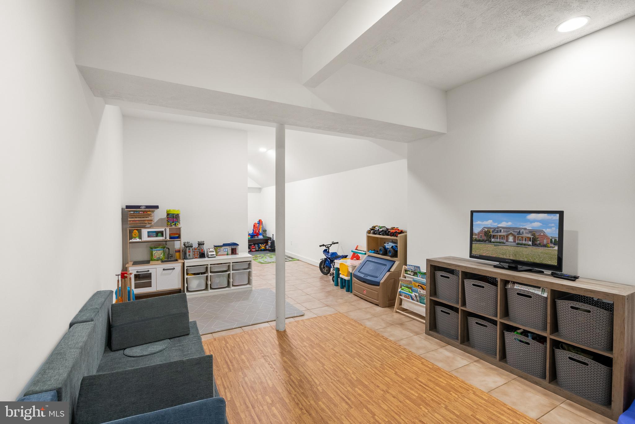 13145 Carriage Ford Road Nokesville, VA 20181 - Photo 51 of 70 a living room with furniture and a flat screen tv