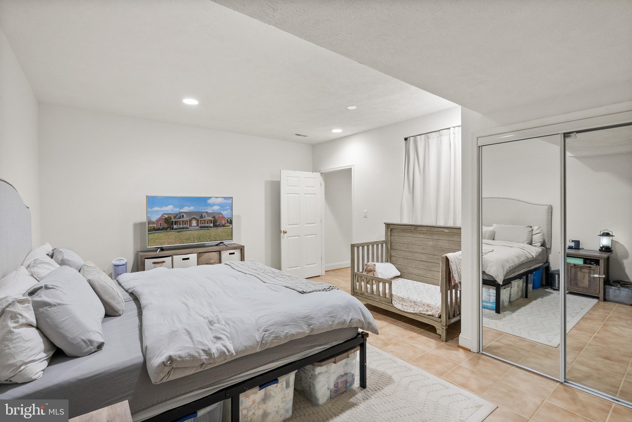 13145 Carriage Ford Road Nokesville, VA 20181 - Photo 54 of 70 a bedroom with a bed and large closet