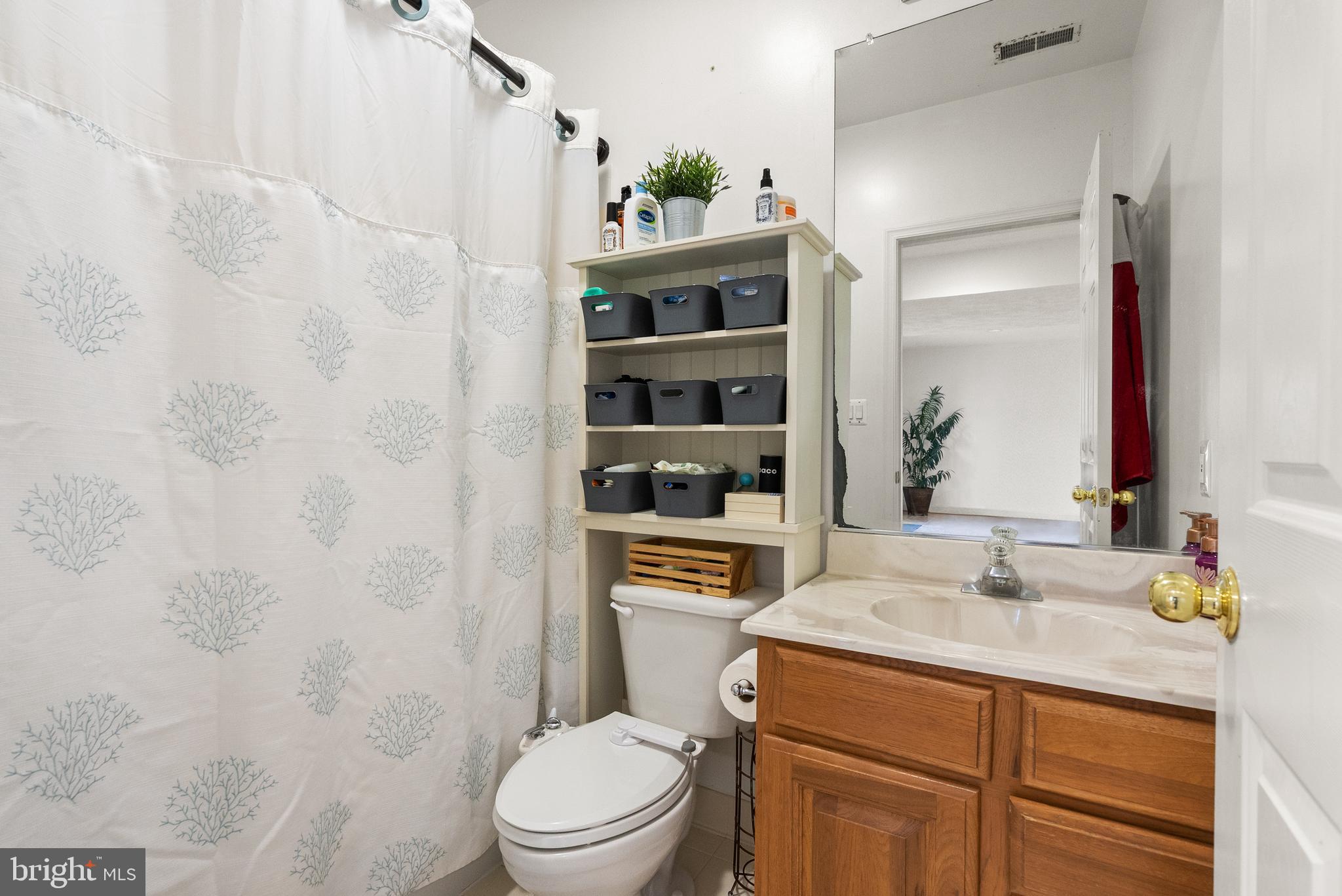 13145 Carriage Ford Road Nokesville, VA 20181 - Photo 55 of 70 a bathroom with a sink a toilet and shower