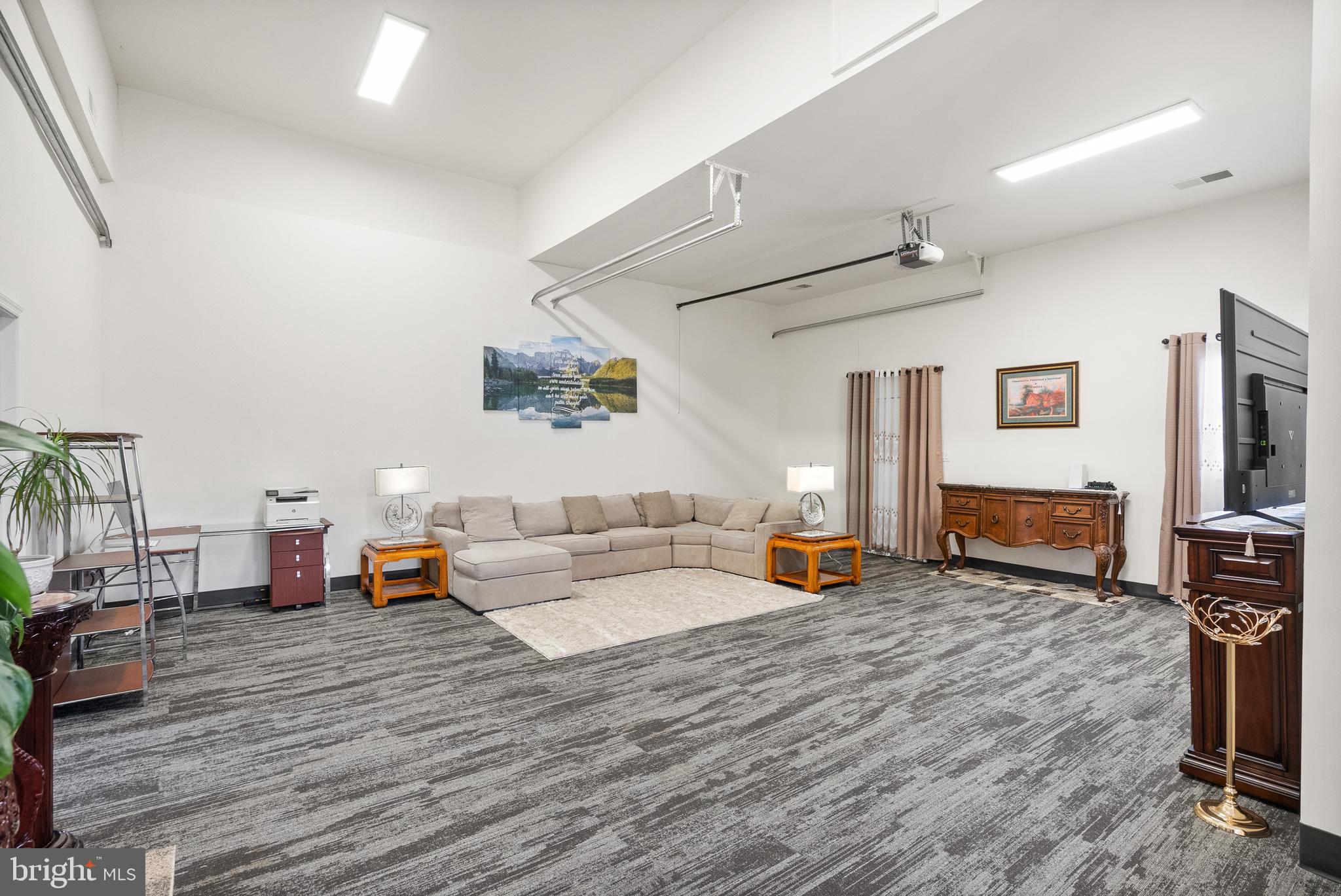 13145 Carriage Ford Road Nokesville, VA 20181 - Photo 65 of 70 a living room with furniture and a flat screen tv