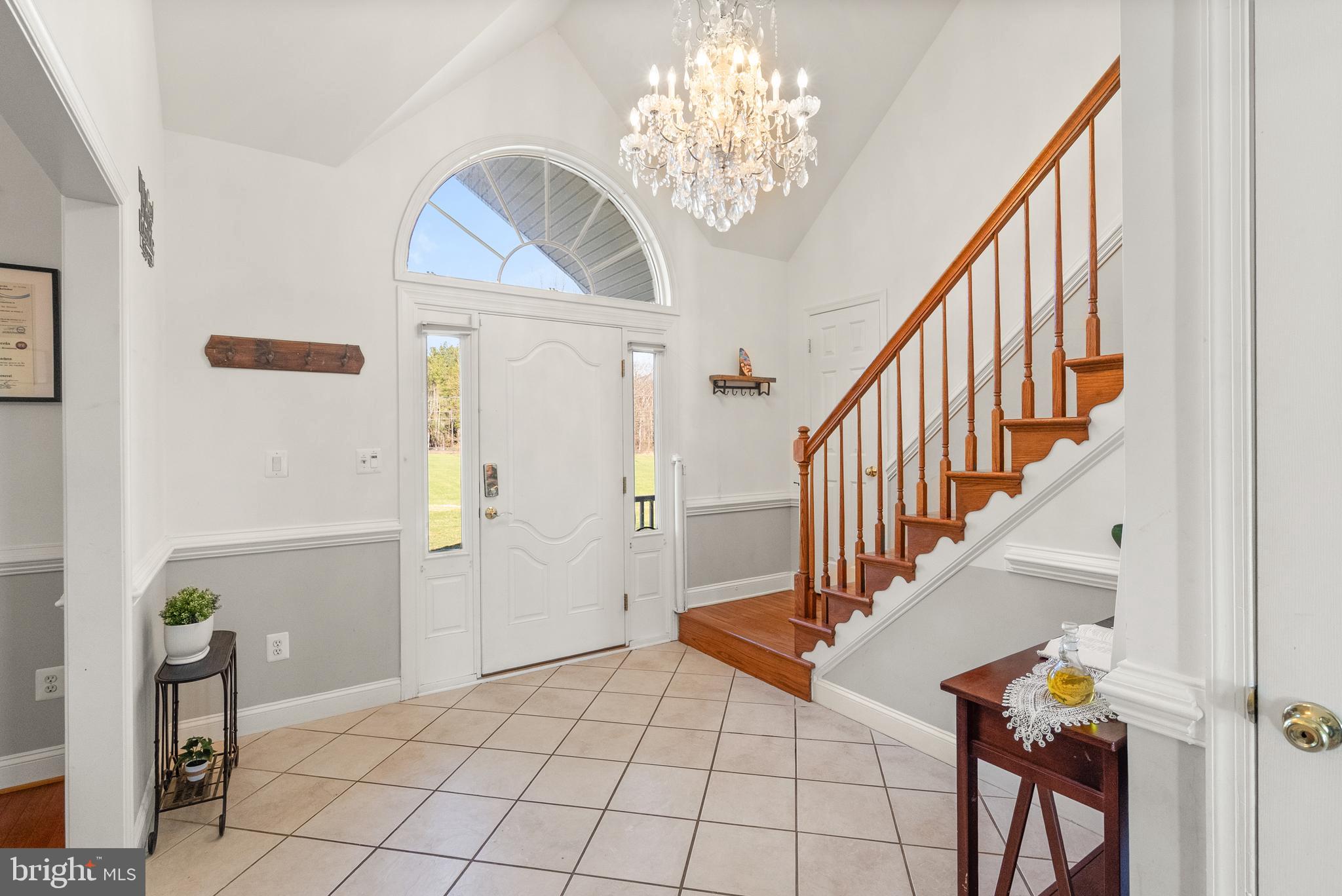 13145 Carriage Ford Road Nokesville, VA 20181 - Photo 9 of 70 a view of entryway and hall with wooden floor