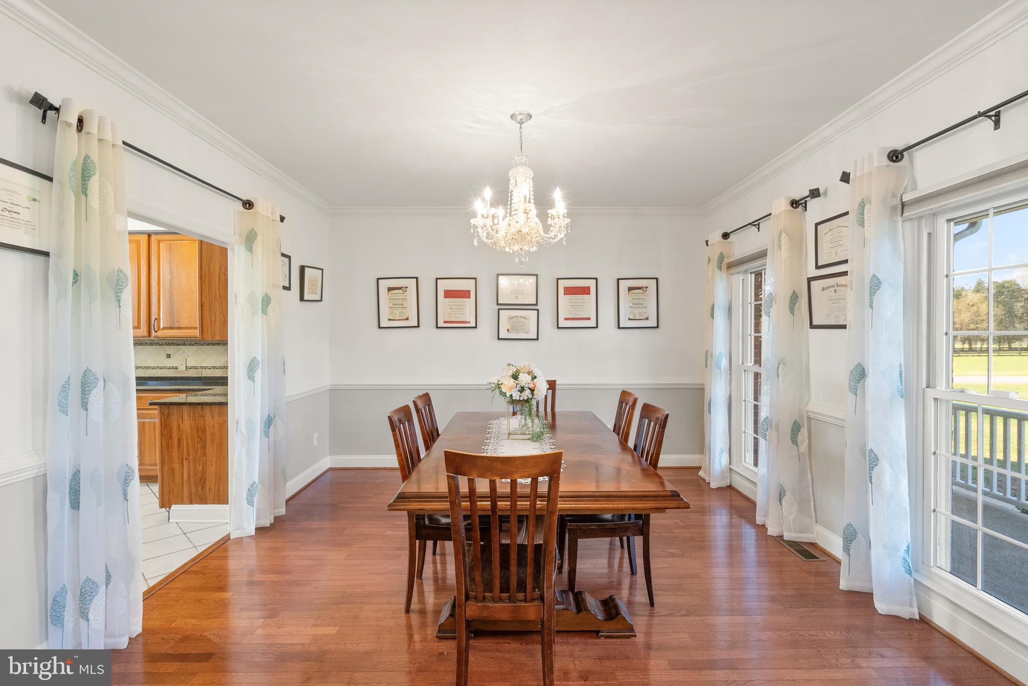 13145 Carriage Ford Road Nokesville, VA 20181 - Photo 10 of 70 a view of a dining room with furniture window and wooden floor