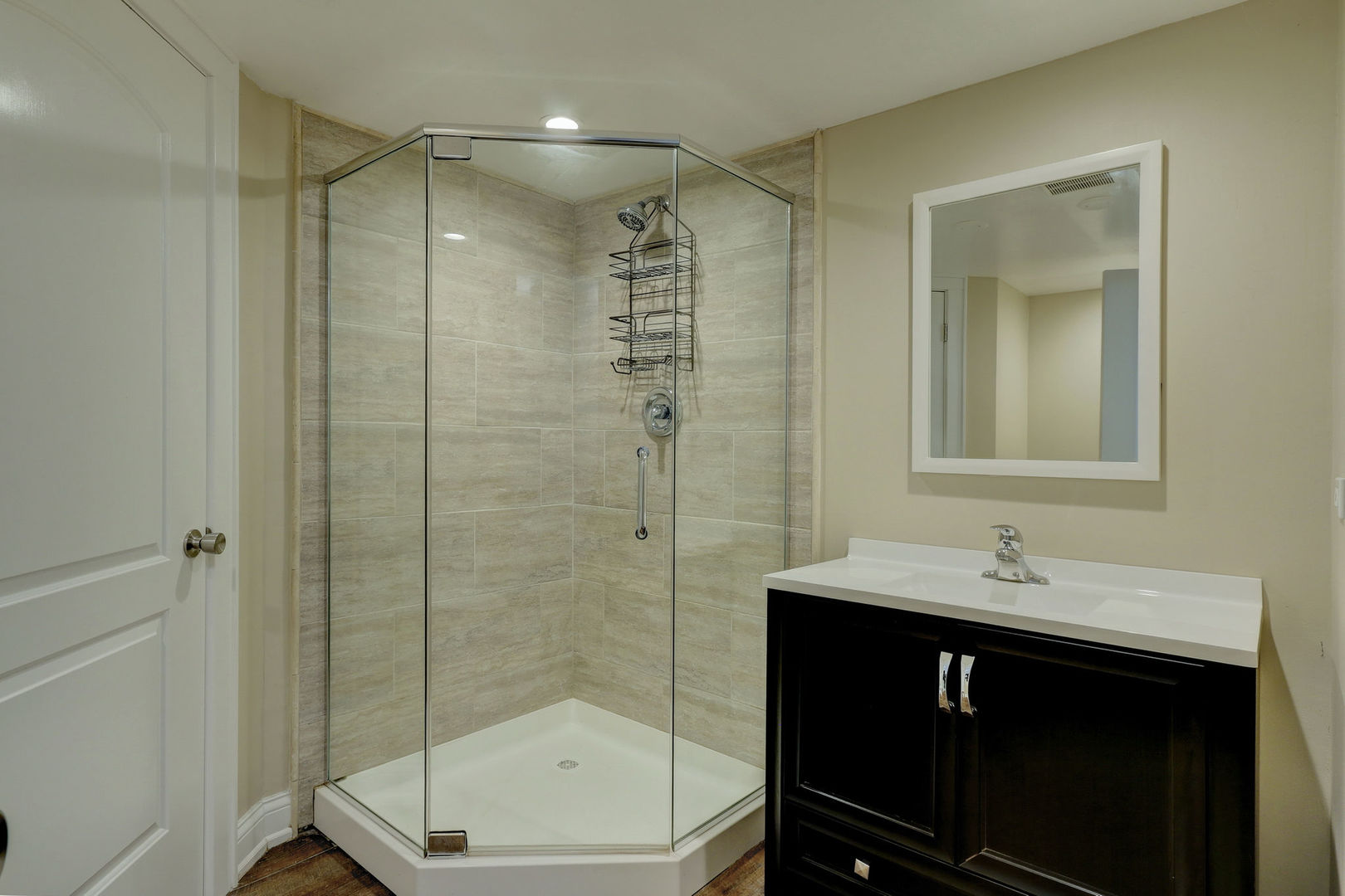 273 Raupp Boulevard Buffalo Grove, IL 60089 - Photo 12 of 18 a bathroom with a sink shower and a mirror