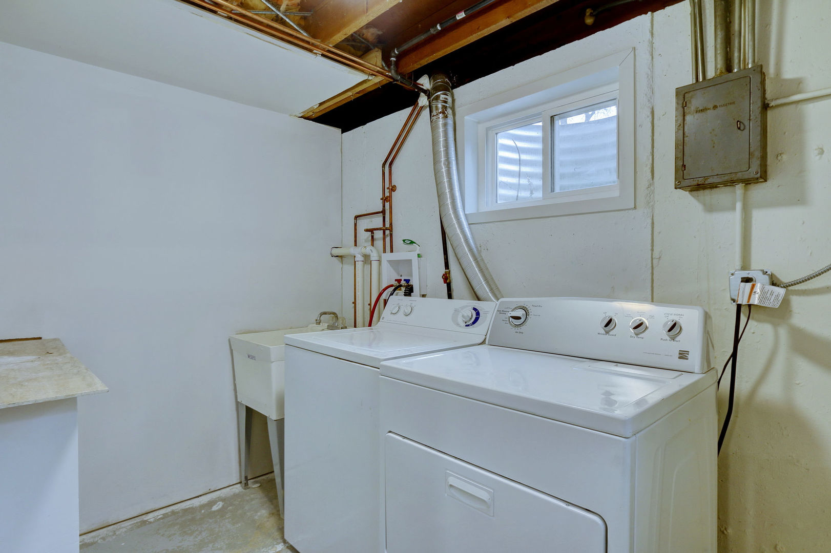 273 Raupp Boulevard Buffalo Grove, IL 60089 - Photo 15 of 18 a utility room with dryer and washer